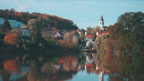 St. Sebastian's and Fabian's Church in Prague Reflecting on a Tranquil Lakeside View