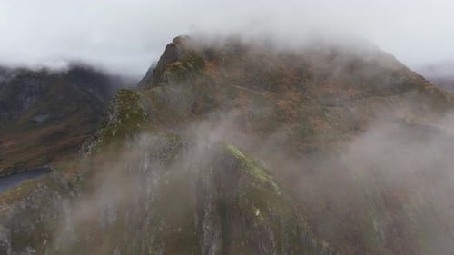 Surveying Norway's Steep Peaks Aerial Exploration From Lofoten's Mountainside