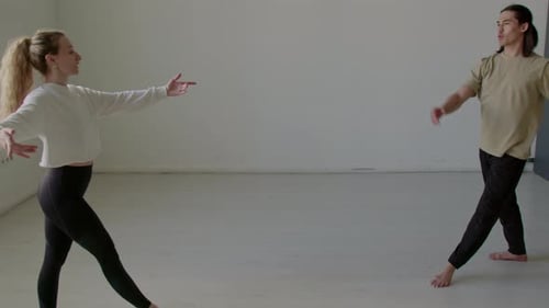 Young Partners Practicing Ballet Dance in Studio