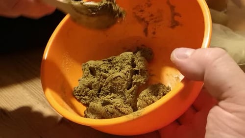 Green superfood Moringa turmeric and ginger powder herbal remedy supplement forming in bowl