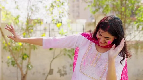 Indian Woman Dancing at Holi party