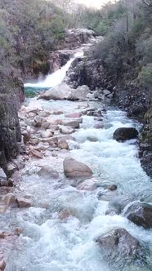 Vertical Video of Beautiful Mountain River with Cascades Flowing on Rocks