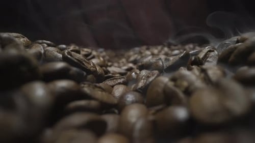 Close Up of Steaming Brown Roasted Coffee Beans