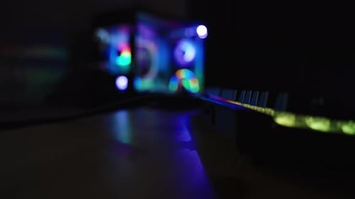 Desktop Computer Lights Glowing in Dark Room