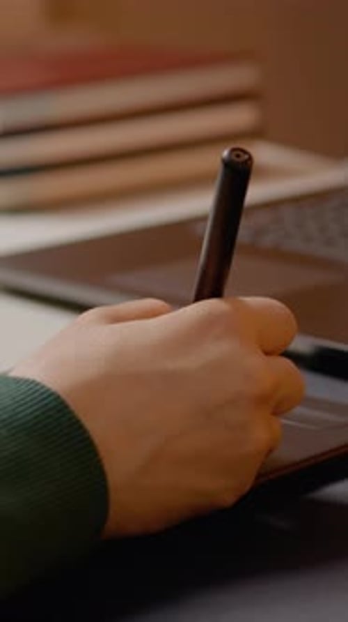 Vertical video Woman using graphics tablet for retouching in studio workspace