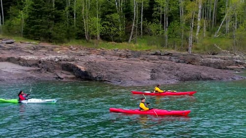 Kayakers on Mountain Lake Aerial Drone View