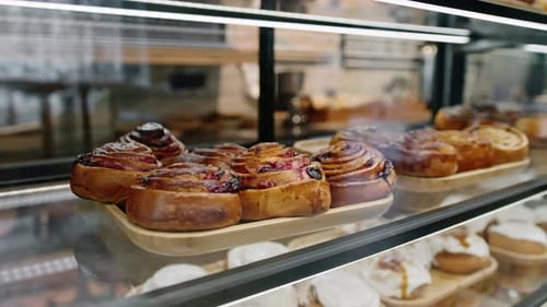 Bun with poppy seeds on the counter of the shop - bakery