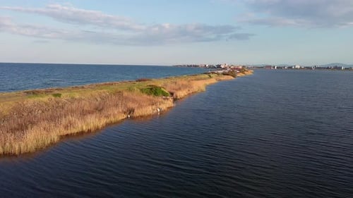 Bird's Eye View of Beach with Sand Grass and Stones Washed By Bay of Black Sea and Lake Under Sky in