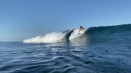 Young Man Surfing in the Ocean