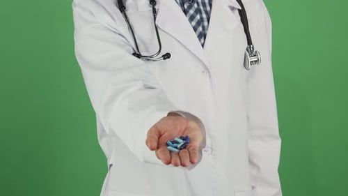 Close up Doctor Offering Medication on Green Screen