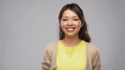 Smiling Young Woman in Yellow Shirt Portrait