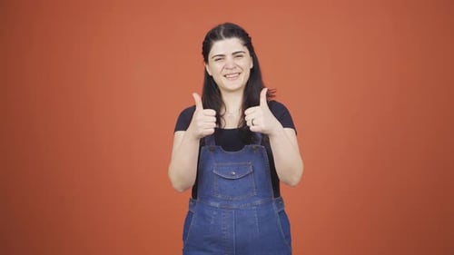 Enthusiastic Woman Gives Two Thumbs Up