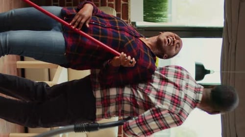 Couple Dances While Cleaning Home