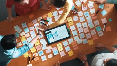 Top view of skilled team shaking hand or making agreement at table. Symposium.