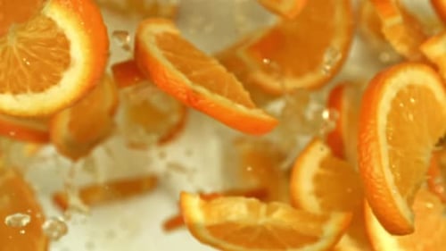 Orange Slices Fly Up and Fall Down Filmed on a Highspeed Camera at 1000 Fps