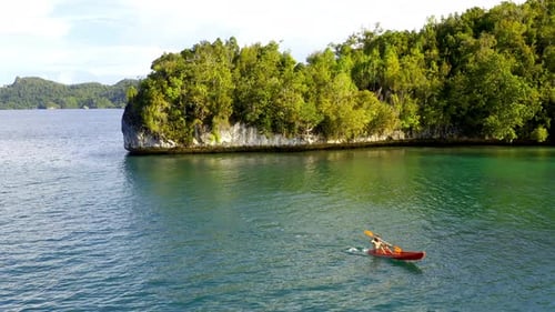 A man kayaking on the Indonesian ocean