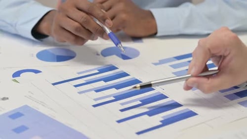 Close up of Business People Working on Documents