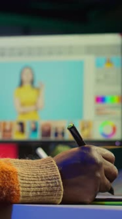 Person Using Graphic Tablet to Edit Photos