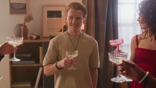 Friends Celebrating Together with Champagne at Indoor Party