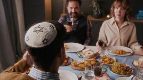 Family and Friends Together at Dining Table