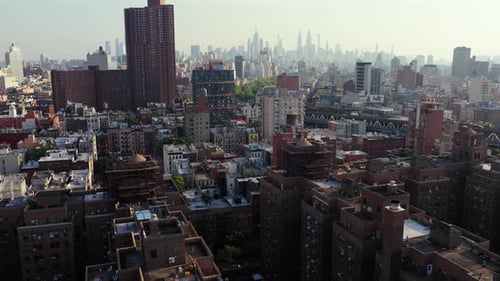 Aerial View of Manhattan's Bustling Cityscape Featuring Iconic Skyscrapers and the Hudson River