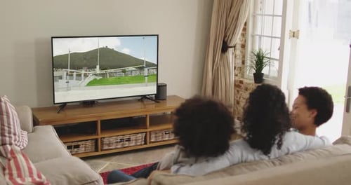 Family Watching Television at Home Together