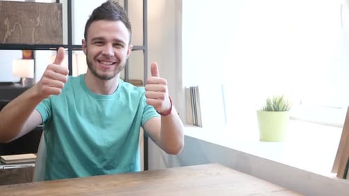 Thumbs Up By Young Man