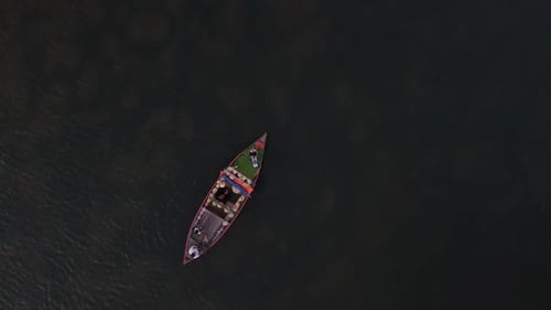 Aerial View of a Sailing Tourist Boat in Hoi An River in Vietnam