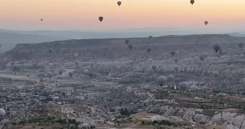 Aerial Cinematic Drone View of Colorful Hot Air Balloon Flying Over Cappadocia