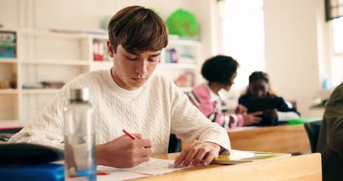 High school, learning and students in classroom studying for exam, test and quiz in lesson