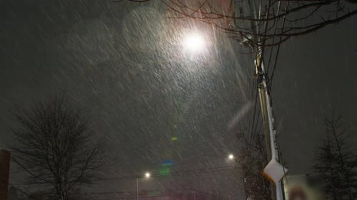 Heavy Snowfall at Night in Urban Setting