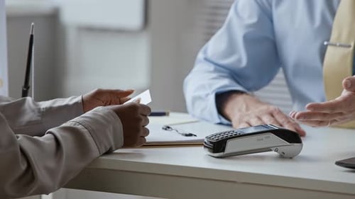 Client Paying by Card on Wireless Terminal Communicating with Manager in Bank