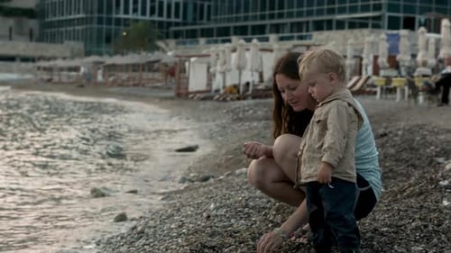 Mother and Child Enjoying Seaside Moment