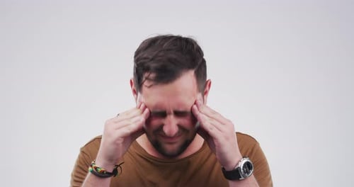 Adult Male Rubbing Temples In Pain