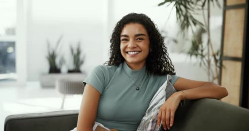 Beautiful Woman Laughing and Smiling on Couch