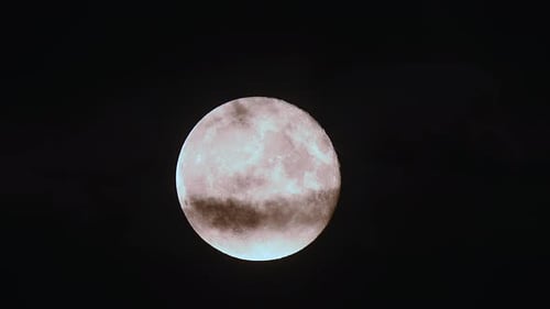 Ethereal Full Moon Ascends in Dark Night Sky