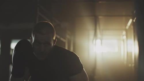 Strong Man Boxing in Gym