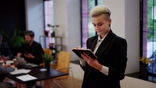 Smiling Businesswoman Financial Analytic Using Tablet Received Fresh News in Office Blonde Hair