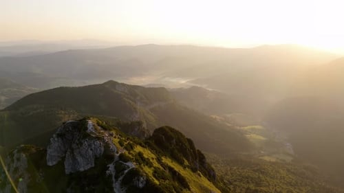 An Aerial Video Slow Dollyout Motion Revealing a Majestic Mountain Peak and Its Surroundings
