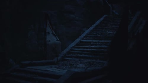 Dark Staircase Leading Into a Mysterious Abandoned Area at Night