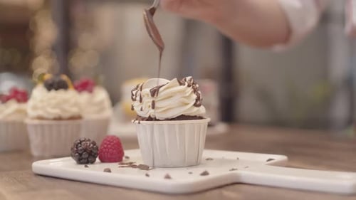 Decadent Chocolate Drizzle Finishing a Perfect Cupcake with Cream Frosting