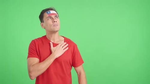 Man Listening to the Chile National Anthem with Solemnity