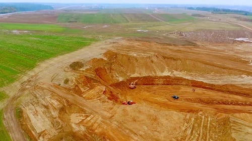 Mining Industry Landscape. Sand Mining in Quarry. Top View of Mining Equipment