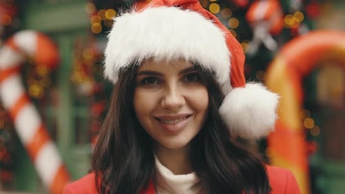 Charming Lady Standing in Festively Adorned City Street Before the New Year's Eve