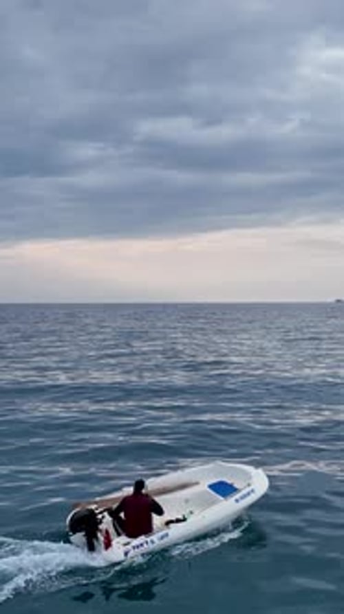Vertical Video Sunset Adventure A Boat's Journey Through the Enchanting Mediterranean Sea
