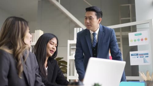 White collar workers are working with team at office.