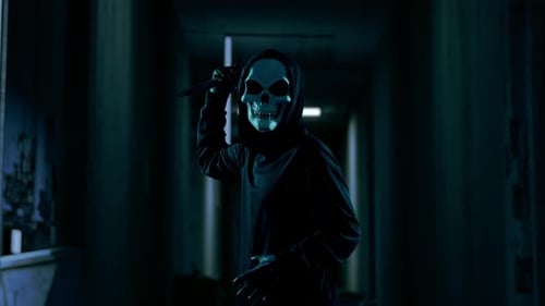 Sinister Masked Figure Wielding Knife in Dark Corridor