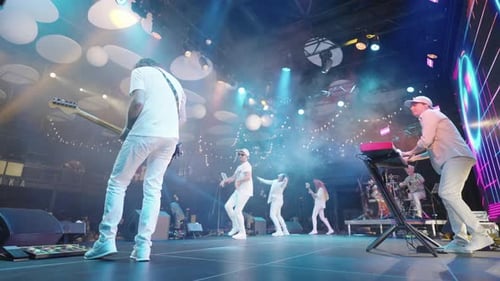 Gig of Contemporary Rock and Pop Music Band Musician are Playing Music and Singing Rear View