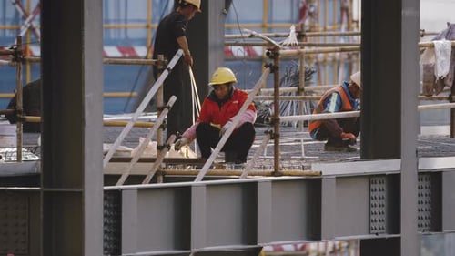 Chinese Woman Construction Worker Doing Her Job