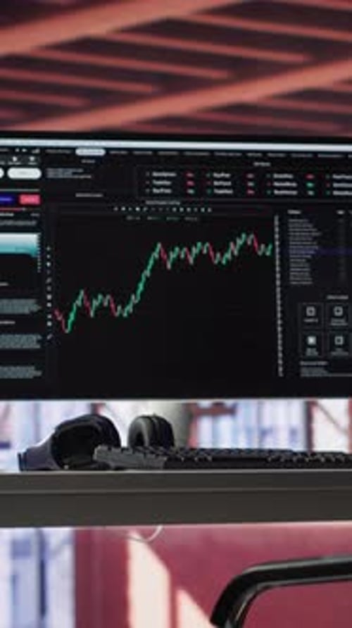 Vertical Video Modern Trading Setup with Monitor Running Forex Trends Going Up